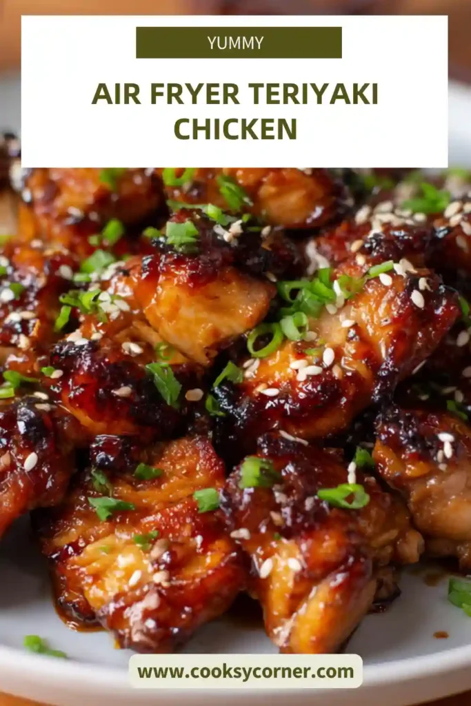 Homemade air fryer chicken thighs coated in rich teriyaki sauce served with rice and vegetables.