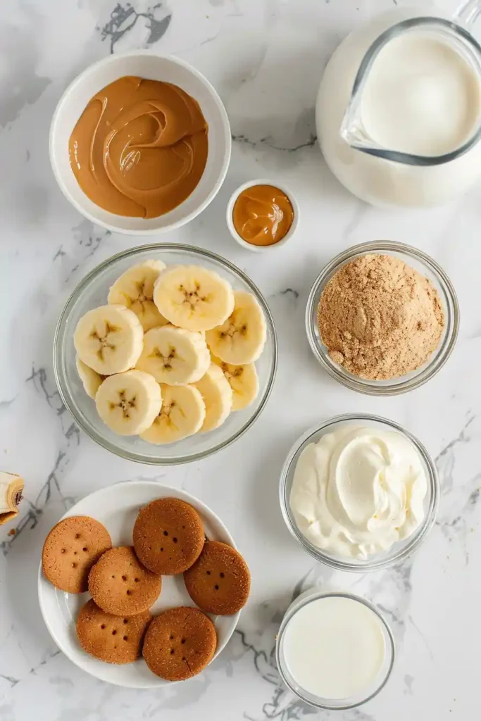No bake Biscoff banana pudding dessert topped with banana slices and caramel flavored cookies.