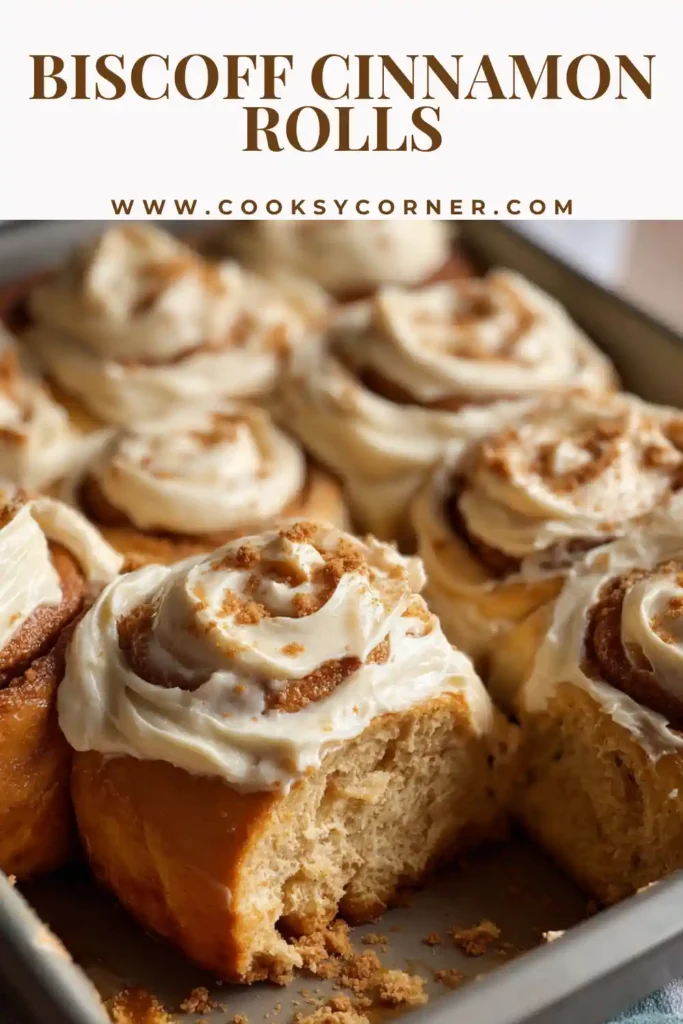 Biscoff cinnamon rolls with cream cheese frosting served warm and gooey in a baking dish.