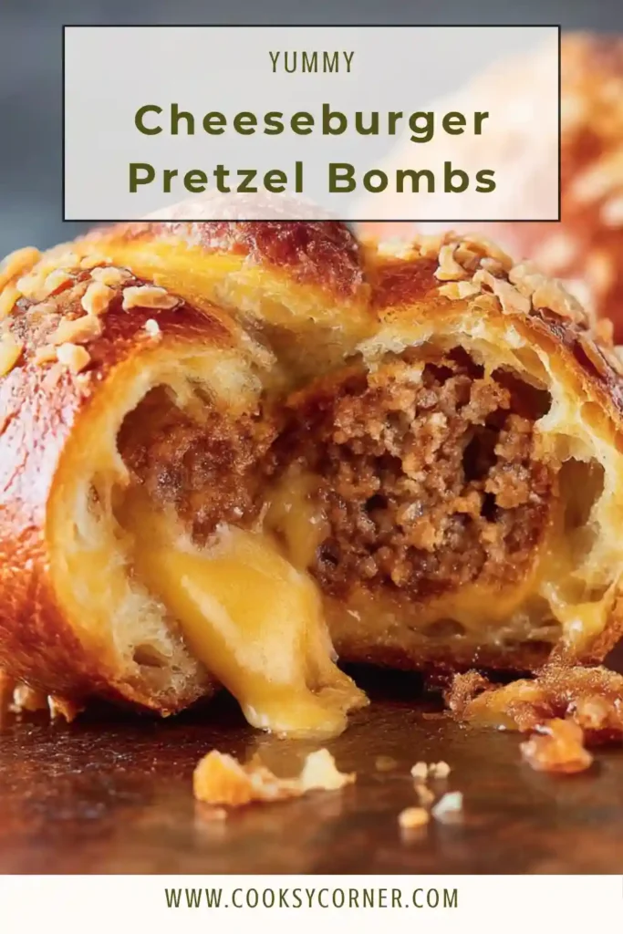 Cheeseburger pretzel bombs baked to golden perfection with melted cheese and juicy beef meatballs inside, served warm on a tray.