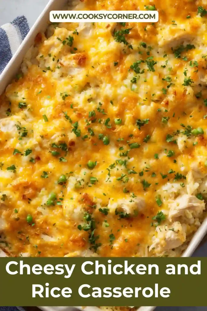 Cheesy chicken and rice casserole baked in a dish with melted cheddar cheese on top.