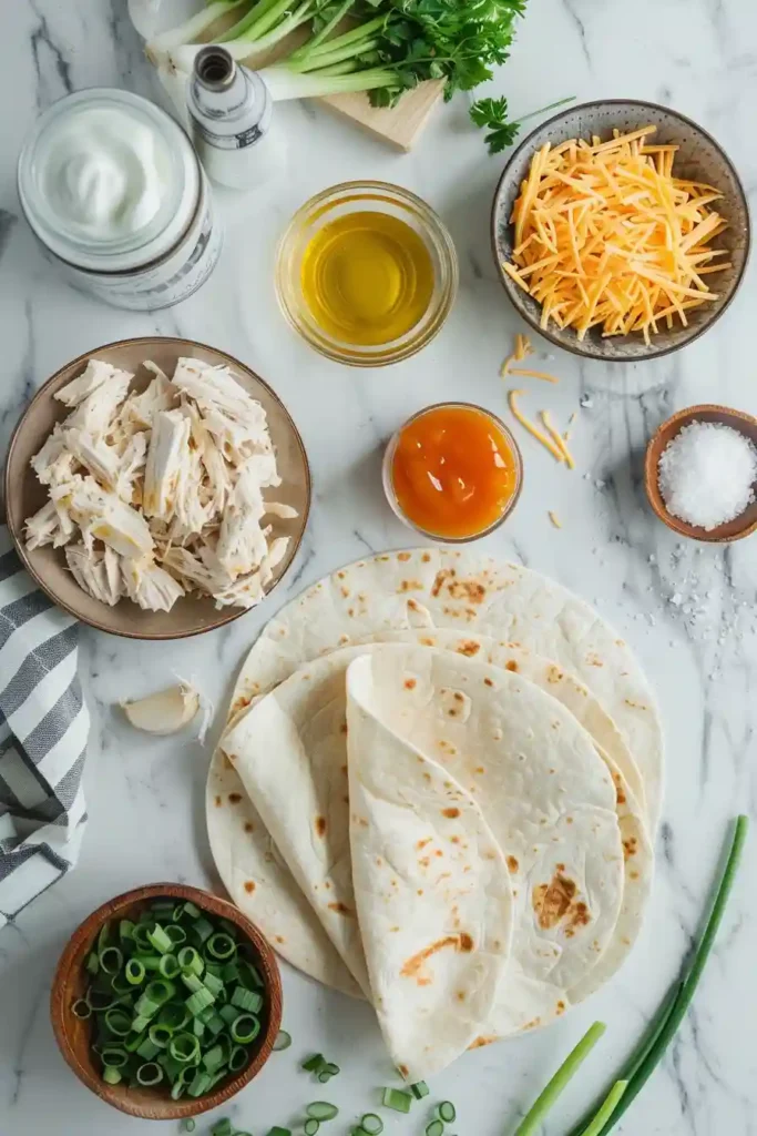 Homemade garlic chicken tortilla wrap cut open to reveal juicy chicken and melted cheese.
