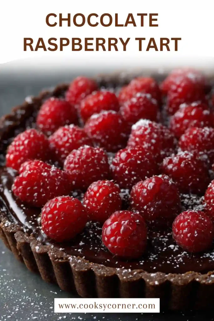 Slice of chocolate raspberry tart showing creamy ganache filling.