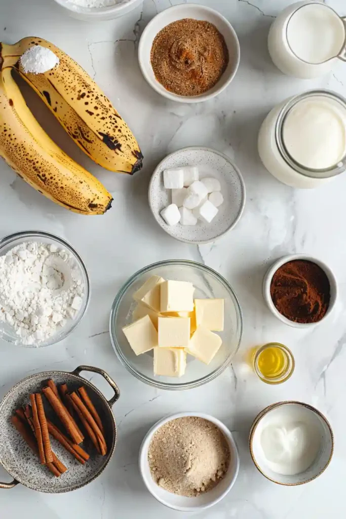 Homemade cinnamon swirl banana bread on a wire rack with icing drizzle.