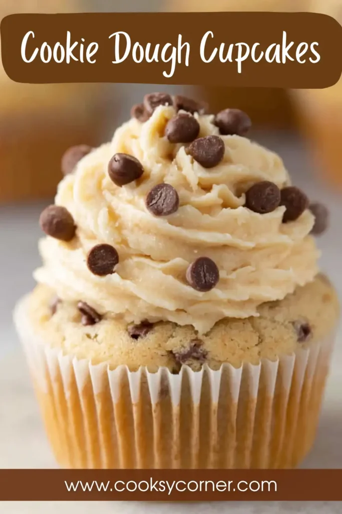Homemade cookie dough cupcakes with mini chocolate chips and creamy buttercream swirl in a bright kitchen setting.