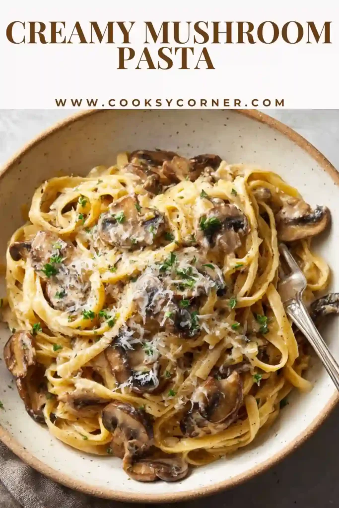 Close-up of creamy mushroom pasta topped with parmesan cheese.