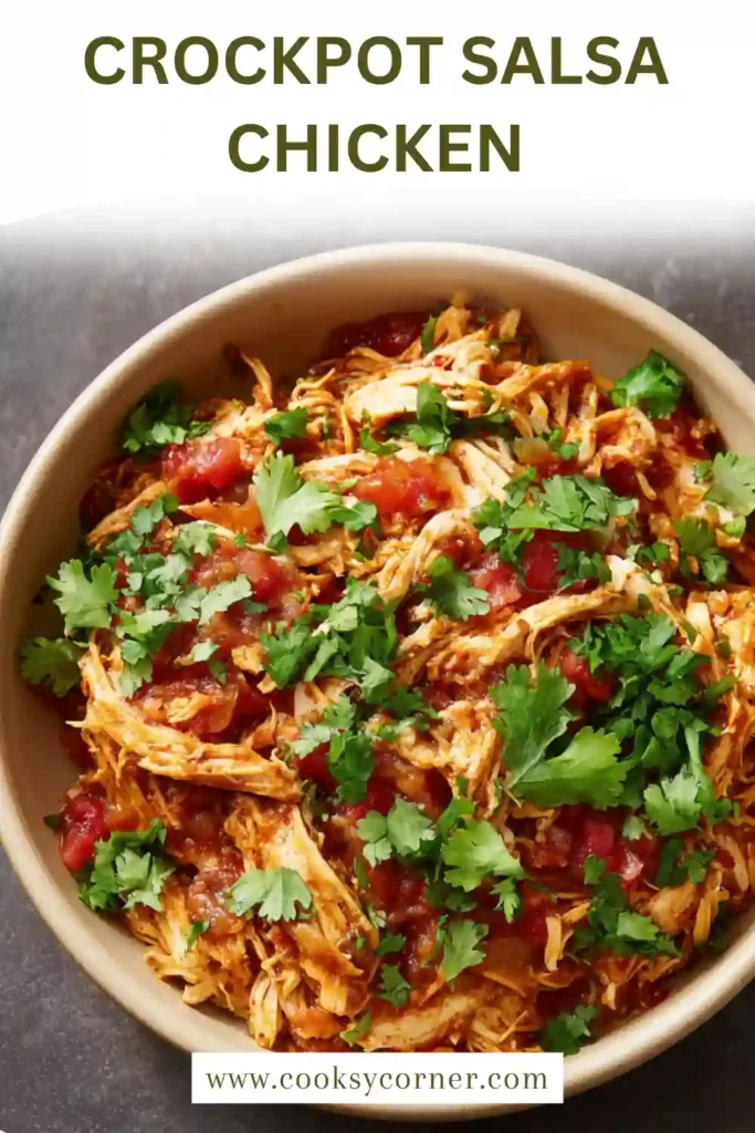 Juicy slow cooker salsa chicken served with lime wedges and cilantro. This easy crockpot recipe is ideal for meal prep.