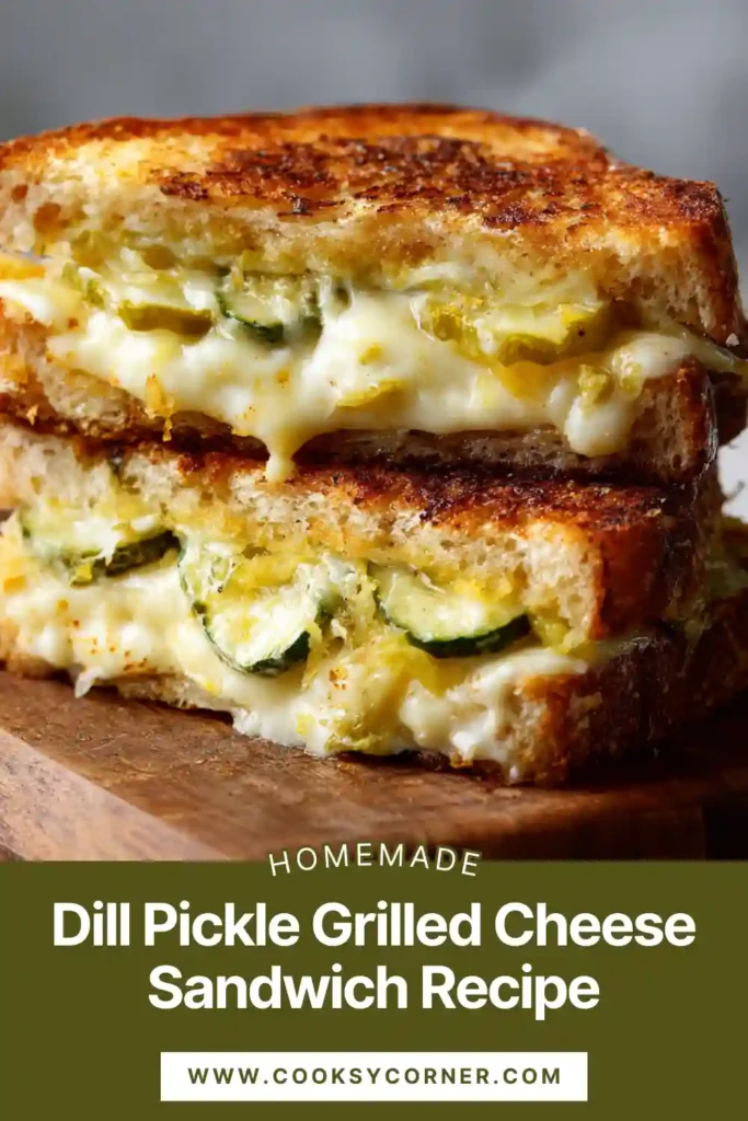 Close-up of a dill pickle grilled cheese sandwich sliced in half showing melted cheese, tangy pickle slices, and crunchy potato chips inside toasted bread.