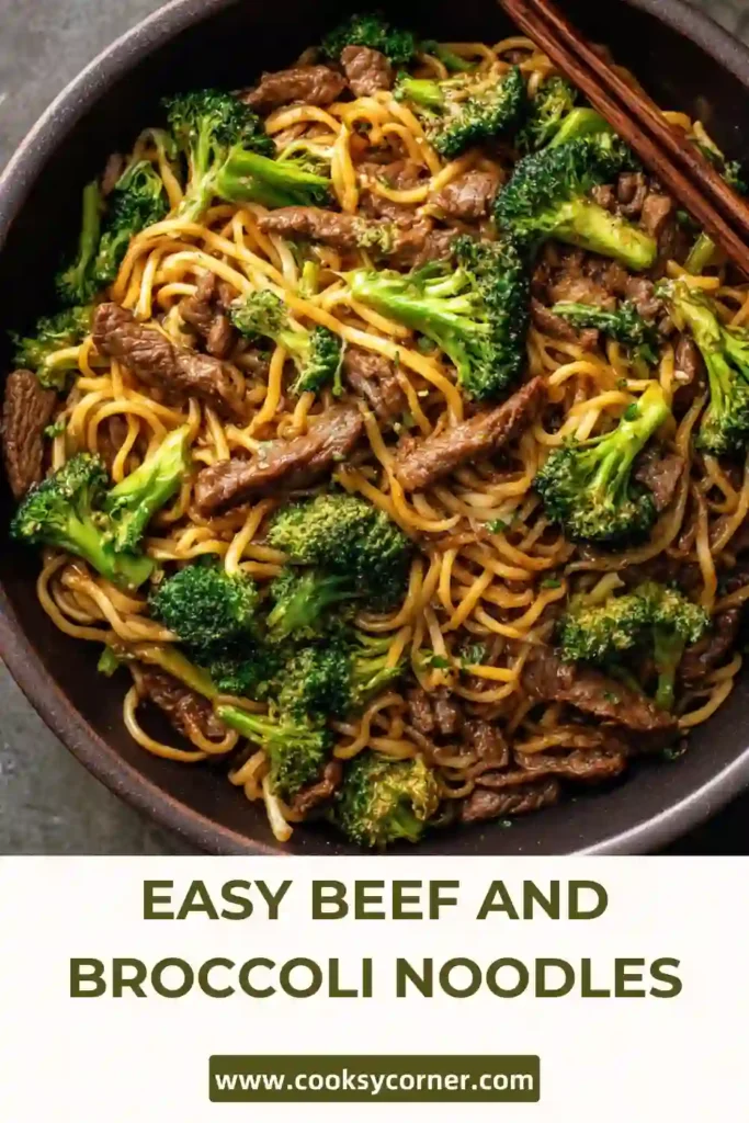 Close-up of homemade beef and broccoli noodles served with sesame seeds and scallions in a flavorful stir fry sauce.