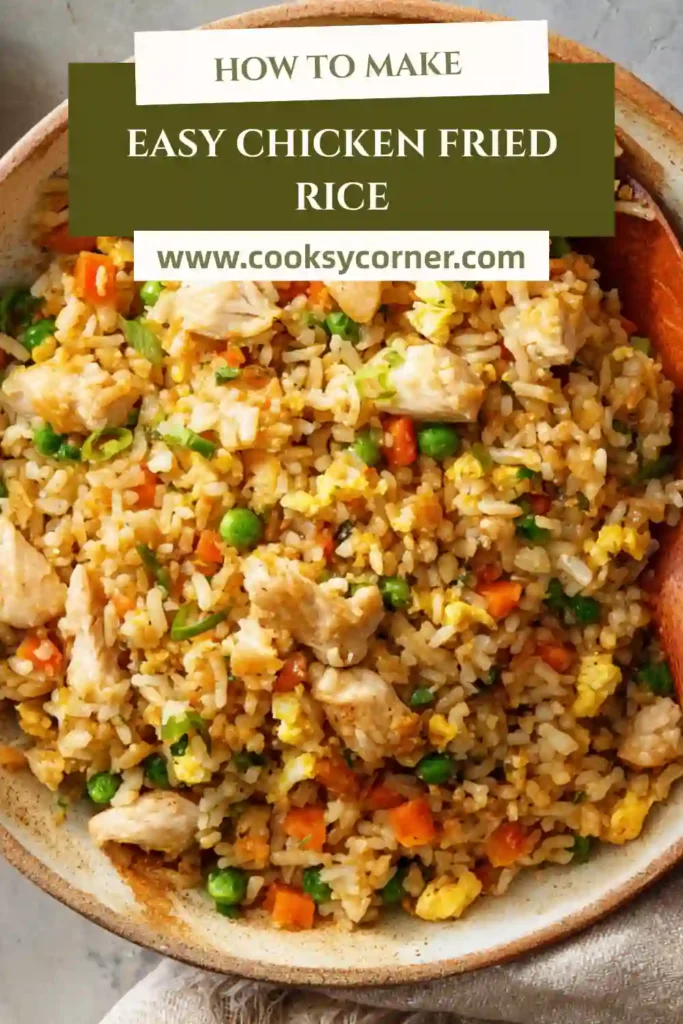 Easy Chicken Fried Rice with diced chicken, vegetables, and scrambled eggs in a skillet.