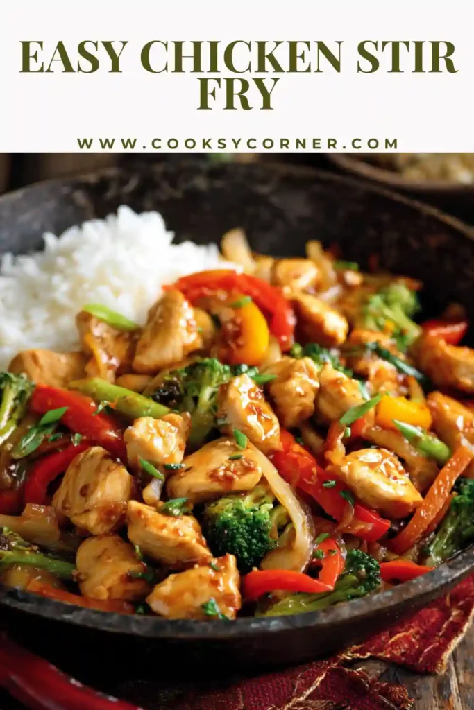 Homemade chicken stir fry with fresh vegetables and savory sauce served over rice.