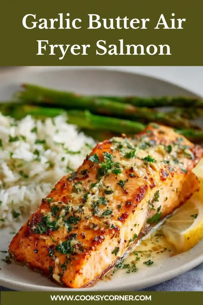 Garlic butter air fryer salmon with parsley and lemon slices.