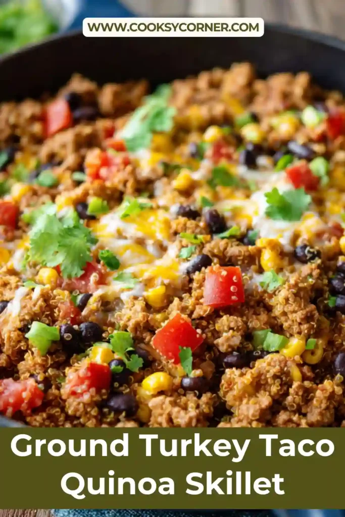 Ground turkey taco quinoa skillet topped with cheese and avocado.