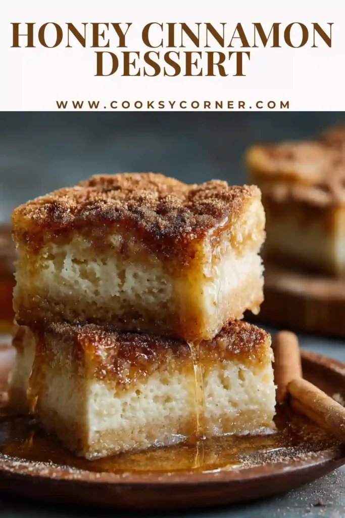Soft honey cinnamon bars sliced into squares on a plate.