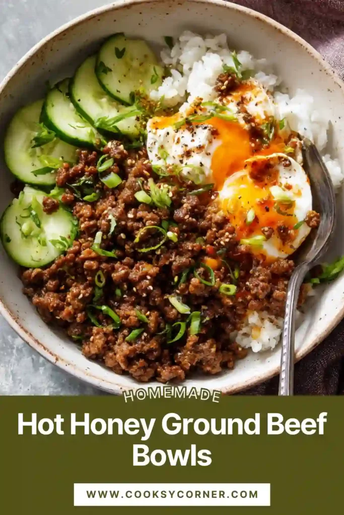 A colorful hot honey ground beef bowl topped with roasted sweet potatoes, seasoned ground beef, cottage cheese, avocado slices, and a drizzle of spicy honey.