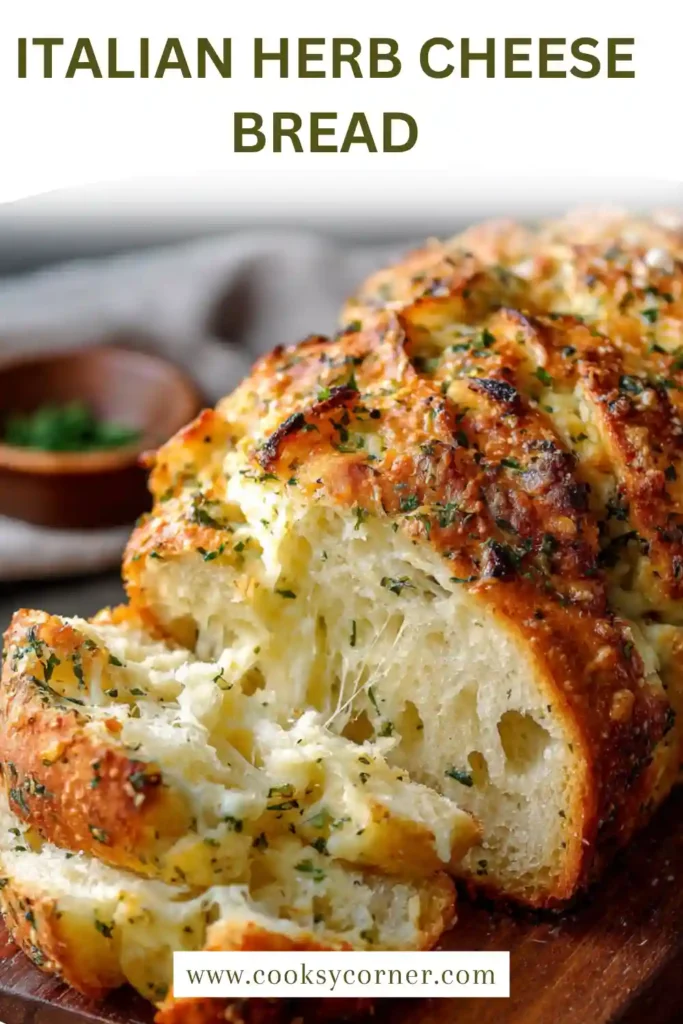 Homemade cheesy herb bread sliced to reveal creamy filling.