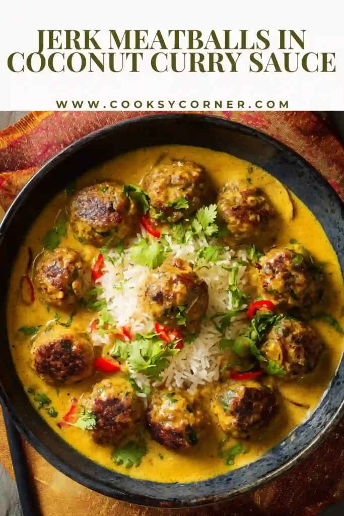 Bowl of jerk meatballs in creamy coconut curry sauce served with rice and scallions.
