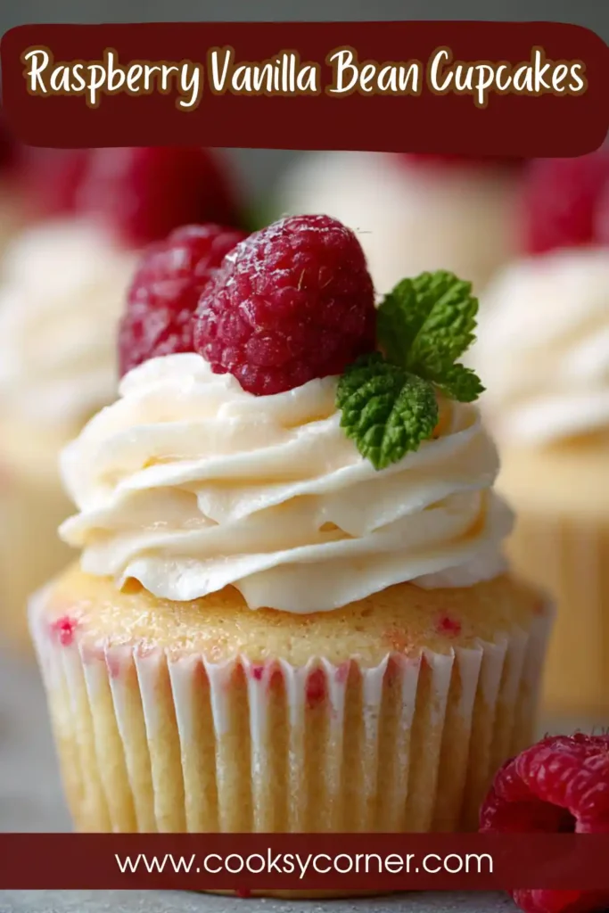 Close-up of vanilla bean cupcakes with raspberry frosting showing airy crumb and rich topping. Ideal for dessert lovers.