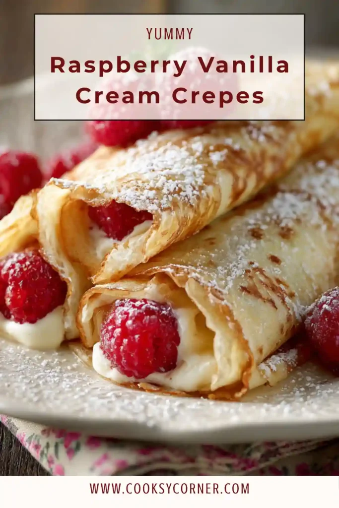 Raspberry vanilla cream crepes filled with creamy filling and topped with fresh raspberries and powdered sugar.