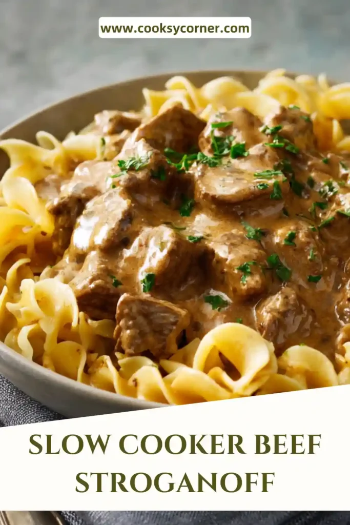 Slow Cooker Beef Stroganoff served over noodles with creamy mushroom sauce and tender beef pieces.