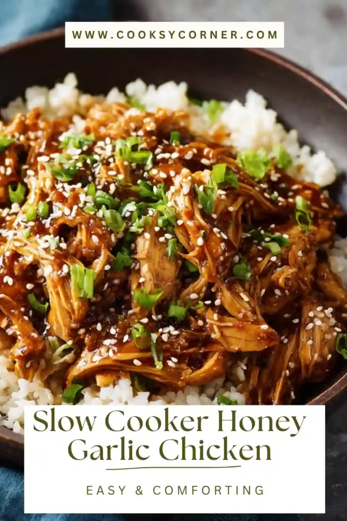 Close-up of honey garlic chicken with rich sauce and garnished with sesame seeds.