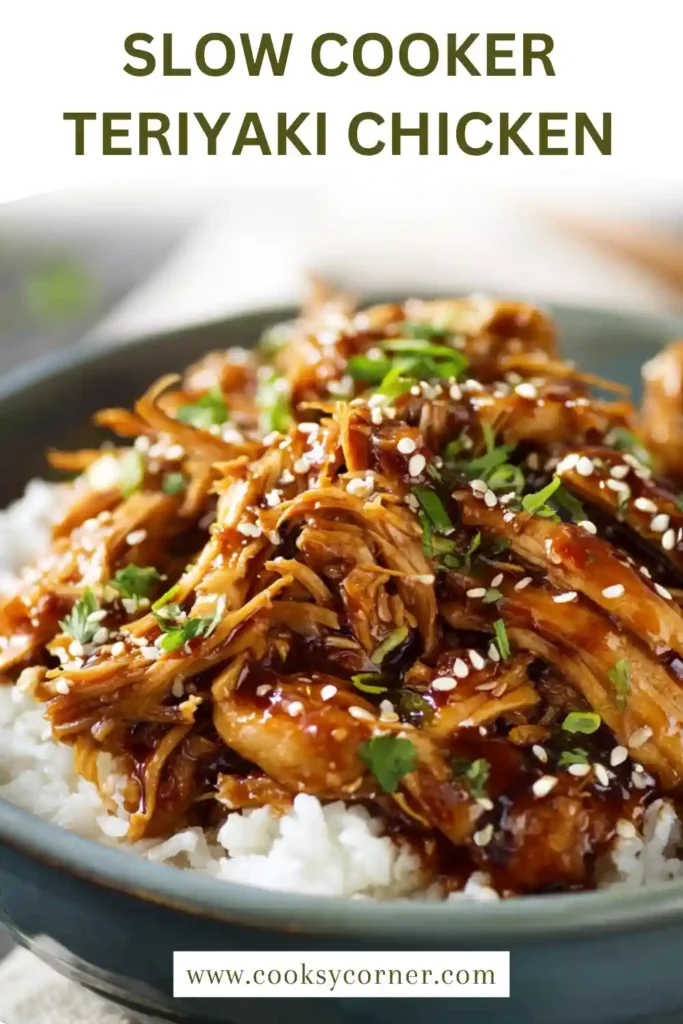 Close-up of teriyaki chicken with thick sauce and sesame garnish.