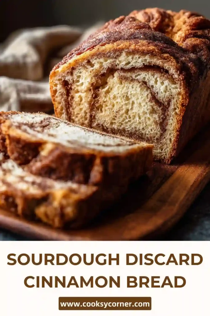 Homemade sourdough cinnamon bread sliced on wooden board with soft texture.
