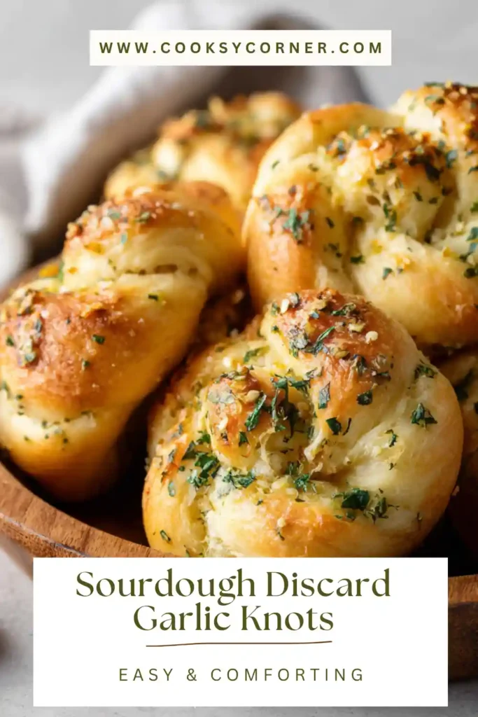 Homemade garlic knots with golden crust and soft interior made from sourdough discard.
