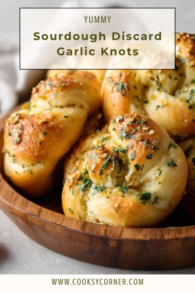 Soft bread knots topped with garlic butter and parsley.