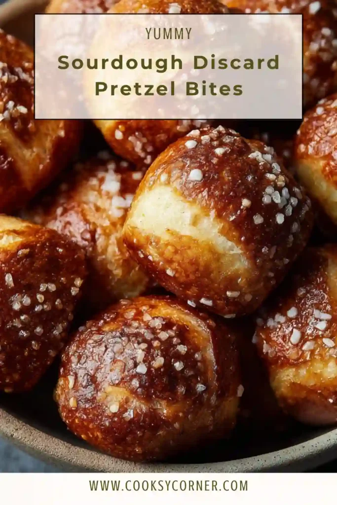 Sourdough discard pretzel bites baked golden brown with flaky salt topping.