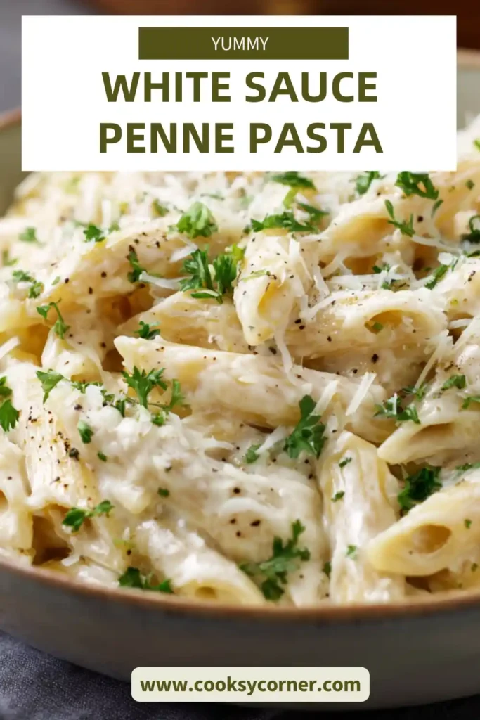 A bowl of creamy White Sauce Penne Pasta topped with melted cheese and parsley, served warm and freshly prepared.