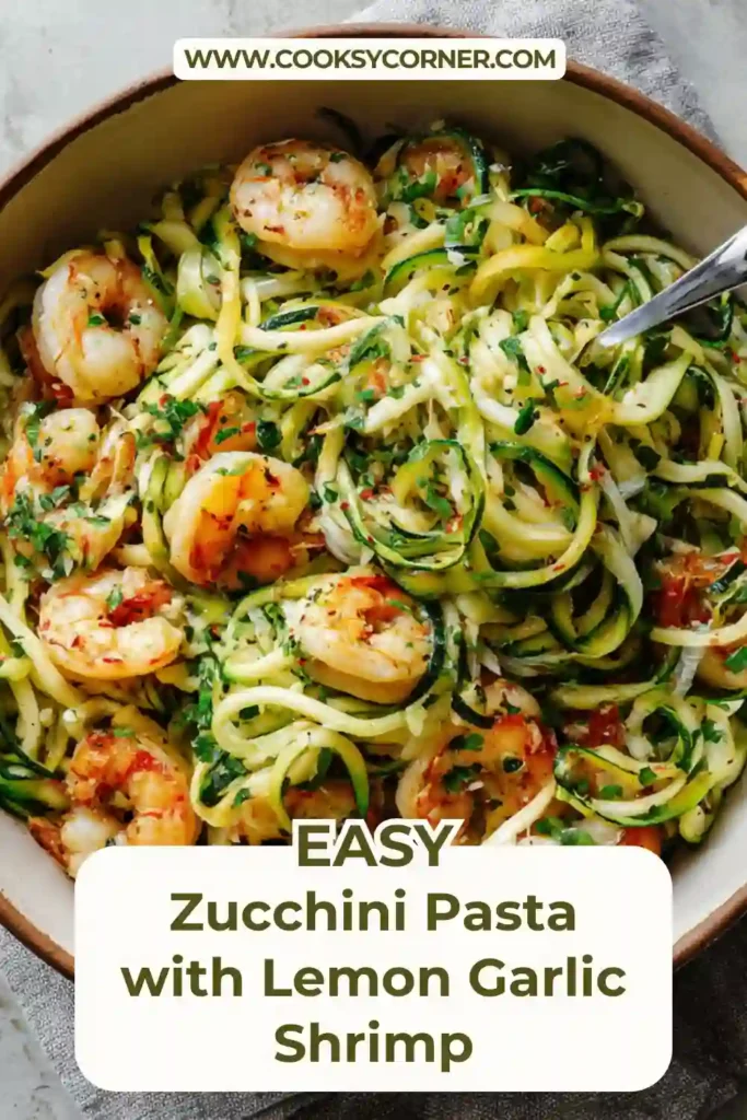 Healthy zucchini pasta with lemon garlic shrimp served in a white bowl with fresh parsley. A quick shrimp zoodles recipe perfect for light weeknight meals.