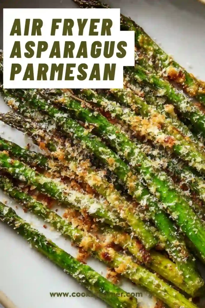 Close-up of asparagus cooked in air fryer with melted parmesan and seasoning. Healthy and flavorful side dish.