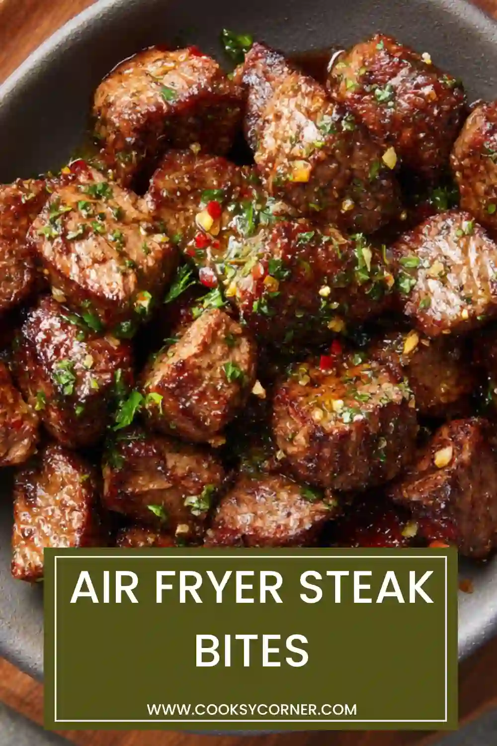 Air Fryer Steak Bites cooked and coated in garlic butter served in a bowl. Juicy and flavorful beef recipe.