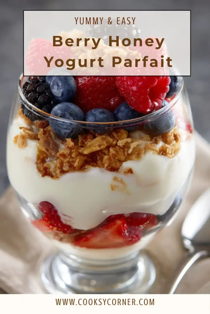 Two glasses of Berry Honey Yogurt Parfait with visible layers of yogurt, granola, and mixed berries. Perfect for breakfast or snack.