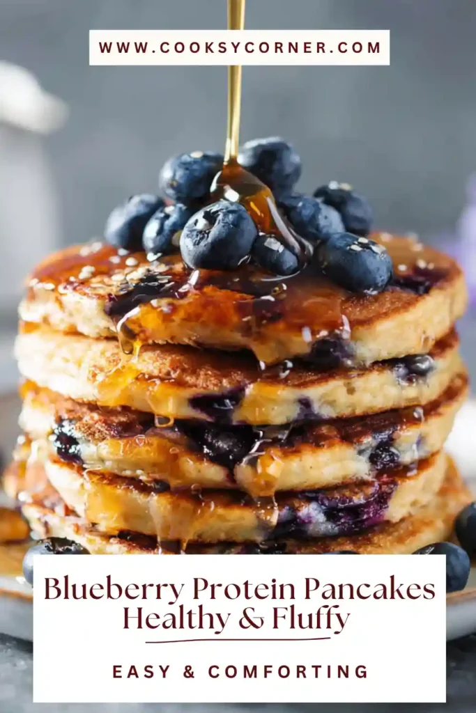 Healthy blueberry pancakes made with almond flour and protein powder, served warm.