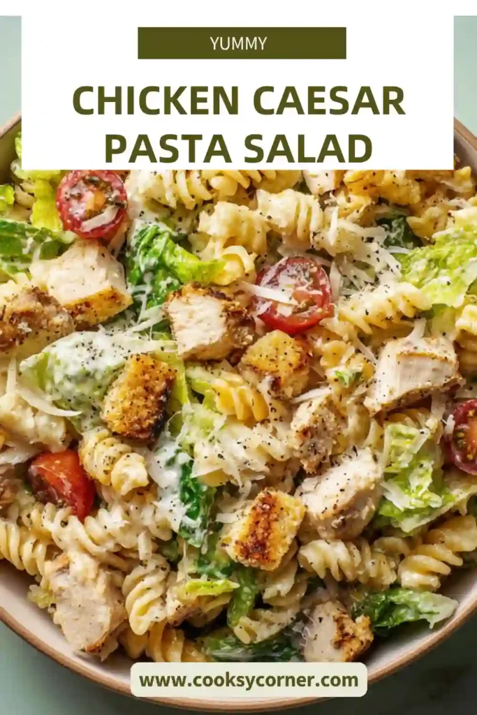 Close-up of creamy Chicken Caesar Pasta Salad with fusilli pasta and shaved Parmesan.