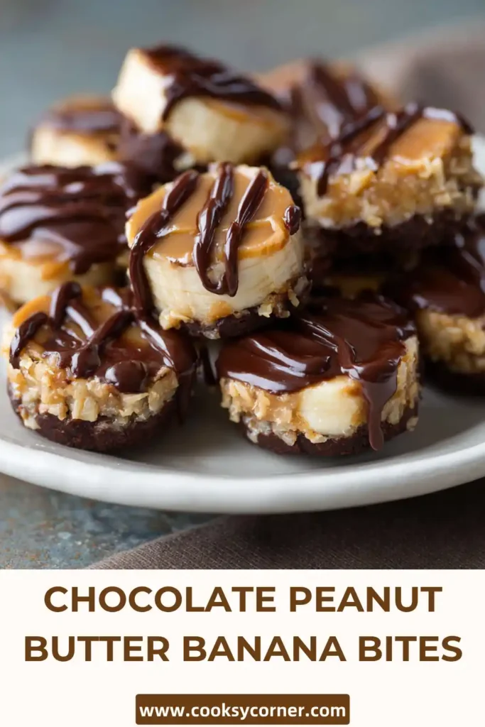 Frozen banana peanut butter bites coated in dark chocolate on a parchment-lined tray.