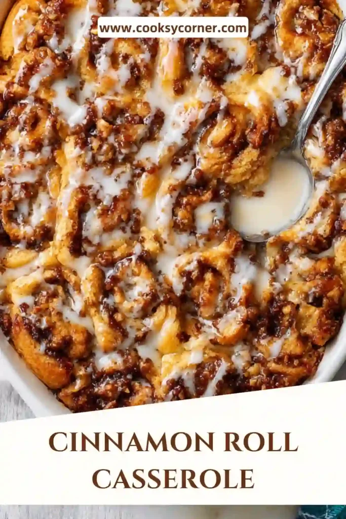 A 9x13 pan filled with Cinnamon Roll Casserole, golden brown on top and drizzled with vanilla glaze.