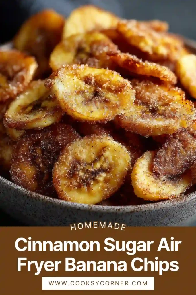 Close-up of homemade banana chips coated with cinnamon sugar and perfectly crisp.