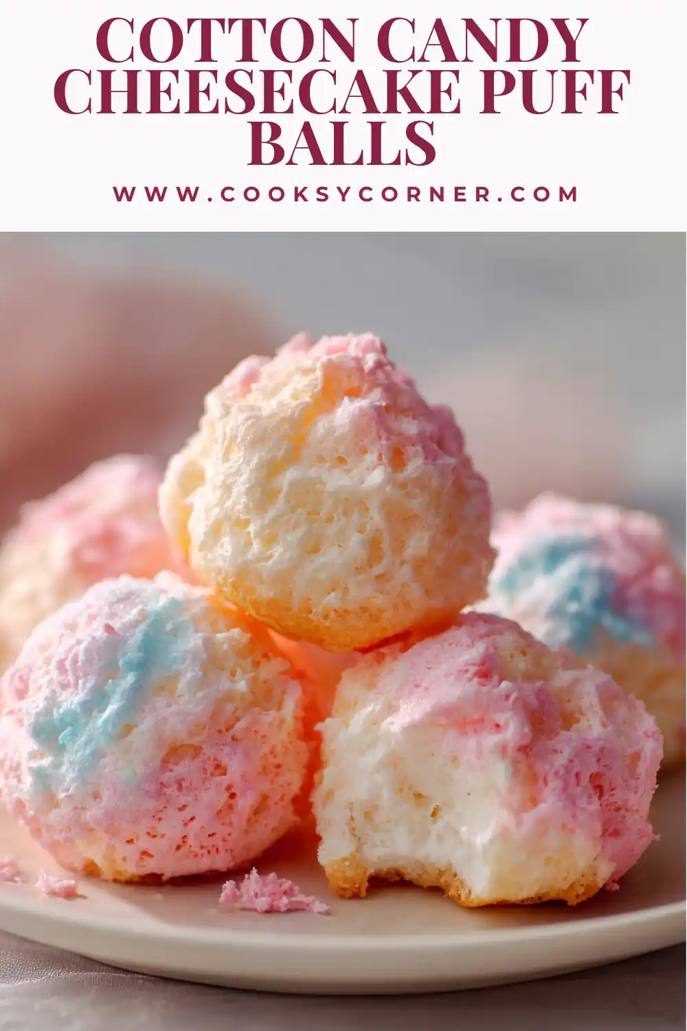Cotton candy cheesecake puff balls with golden pastry and colorful topping.