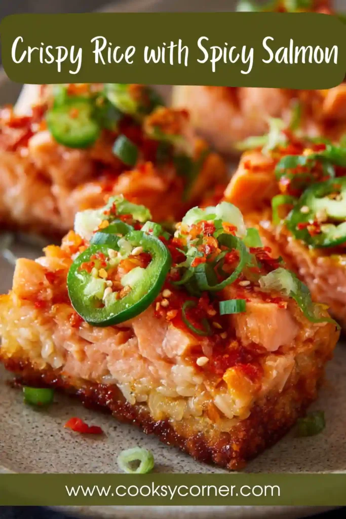 Crispy rice topped with spicy salmon and avocado slices. Sushi-style appetizer with vibrant colors.
