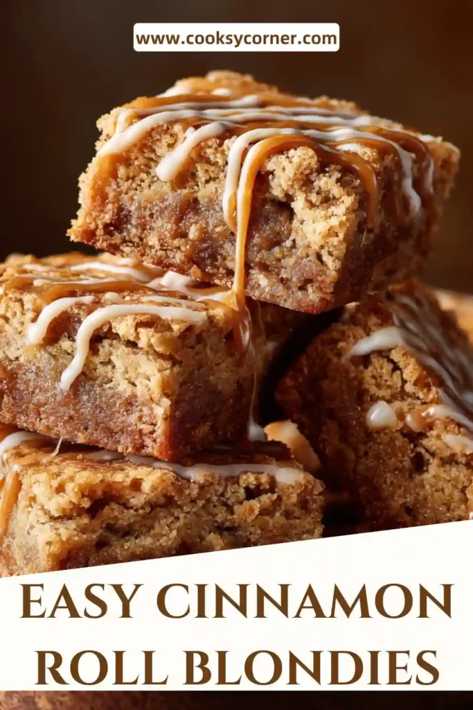 Homemade Cinnamon Roll Blondies in a baking pan with visible cinnamon sugar swirls and creamy glaze.