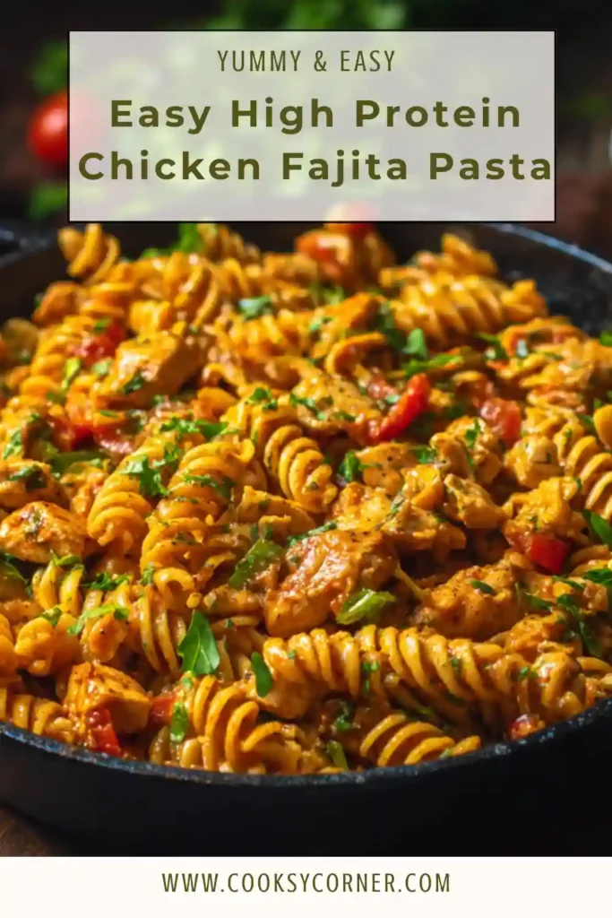 High protein chicken fajita pasta served in a bowl with peppers and creamy sauce. The dish looks rich, colorful, and freshly garnished with parsley.