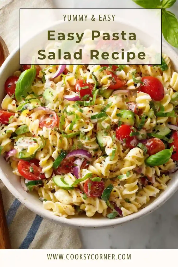Close-up of Mediterranean pasta salad with fresh herbs and lemon dressing.
