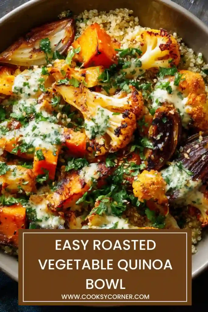 Close-up of a roasted vegetable quinoa bowl featuring sweet potatoes, peppers, and grains in a rustic dish.