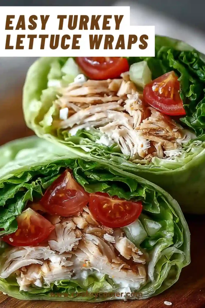 Fresh turkey lettuce wraps filled with cheese, tomato, and onions wrapped tightly in crisp lettuce leaves. Perfect low carb meal option.