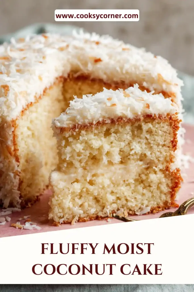 Homemade coconut cake with three layers and white frosting covered in shredded coconut. Elegant dessert.
