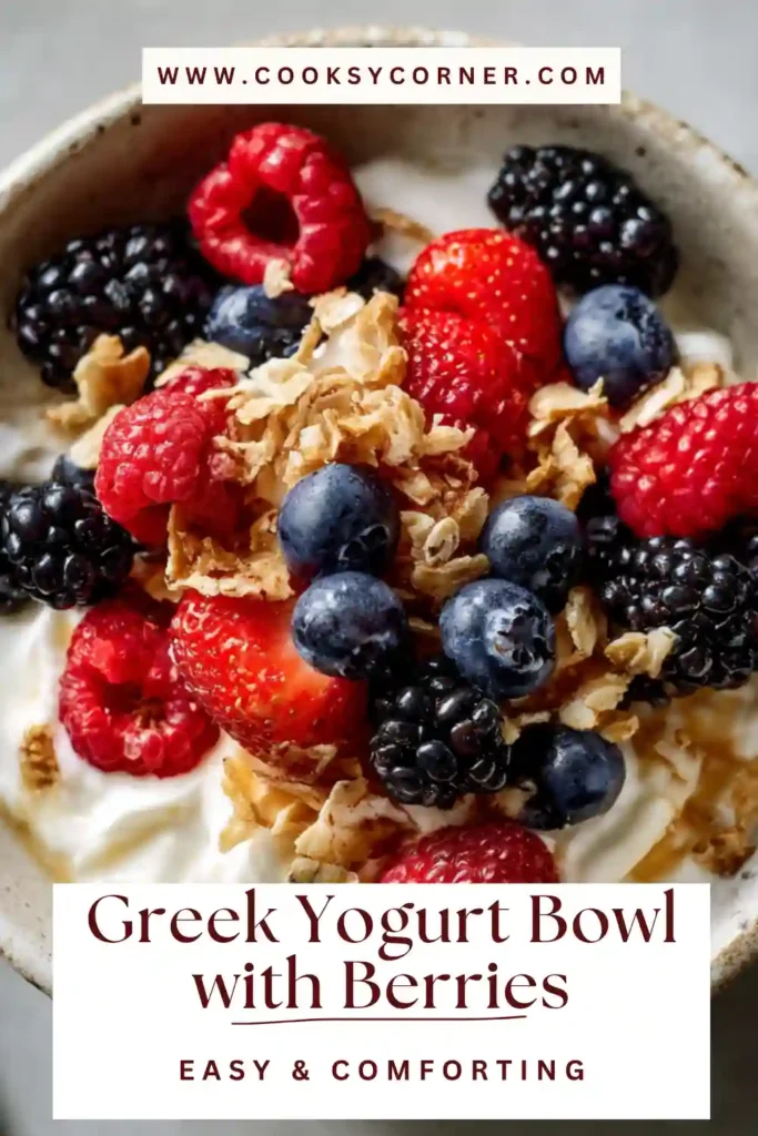 Healthy Greek yogurt bowl with berries and honey drizzle in a white bowl. The mix of textures makes it a perfect breakfast option.