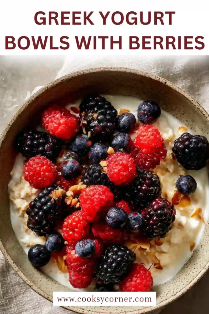 Close-up of creamy Greek yogurt with mixed berries and granola for a nutritious breakfast.